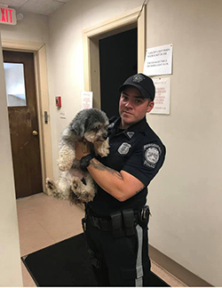 police officer with lost dog